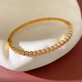Elegant gold-tone stainless steel heart-shaped bangle with sparkling cubic zircon stones - Gold (Style 6)
