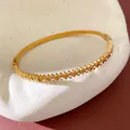 Elegant gold plated stainless steel bangle featuring sparkling cubic zirconia stone accents - 7# Bangle-Gold