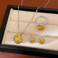 Detailed shot of elegant yellow zircon necklace ring and earrings set in display box - Necklace Earrings And Ring / Silver-Yellow