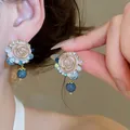 Detail shot of sweet floral earrings with blue beads and crystals on silver needle. - 37# Stud Earrings - Gold - Blue - Pink