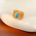 Macro view of vintage gold-plated hollow floral ring with turquoise and zircons - Hollow Flower Ring (HR3329) / Gold