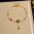 Detailed view of gold-plated anklet with colorful zircons and butterfly tassel - Colorful Rhinestone Butterfly Tassel (B2152) / Gold
