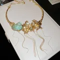 Detailed view of luxury gold flower necklace with turquoise seashell and long tassels. - Choker-Flower Conch Tassel Style / Gold