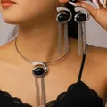 Close-up of fashion-forward snail spiral choker and long tassel earrings on a model. - Earrings Necklace Set / Silver Black