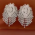 Macro view of oversized rhinestone tassel earrings with silver needles and luxury finish. - Silver Earring Post Style / Silver