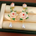 Macro view of vintage-style enamel flower earrings with elegant teardrop pearls. - Flower Drop Style (HE32805) / Gold Plated Pink