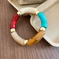 Detailed view of a bohemian multi-color acrylic beaded bracelet with gold spacers. - Style 3 Bracelet / Colorful