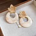 Close-up of French vintage gold flower earrings with elegant marble resin hoops - Flower Round Stud Earrings (HE33078) / Khaki