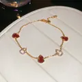 Detailed view of an 18k gold plated gourd bracelet featuring red enamel and pavé-set zircons. - Bracelet (4#)
