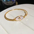 Elegant 18k gold plated bangle featuring a mother-of-pearl oval and North Star zircon detail. - Bracelet (1#)