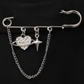 Detailed view of rhinestone heart and star charms on a silver safety pin chain brooch - Heart Planet and Four-Pointed Star (6442) / Silver