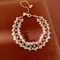 Elegante bracciale in maglia dorata con perle di vetro e catena di estensione regolabile - Oro-Bianco