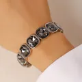 Macro view of an elegant silver elastic bracelet with square dark grey faceted crystals - Silver Square Stone Elastic Bracelet (23)