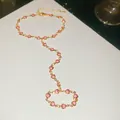Detail of pink heart crystal finger bracelet in gold finish - Gold-Pink Heart Style