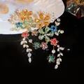 Close-up of sparkling multi-colored crystal flower earrings for elegant banquet wear - Silver Needle / Gold-Multicolor