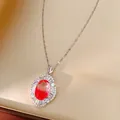 Elegant detail of a court style necklace with a brilliant red oval zircon pendant. - Silver Tone Gradient Red