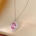 Close-up of elegant pink oval zircon pendant necklace with sparkling stone accents - Silver-Pink