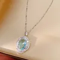 Detail of elegant palace style silver necklace with oval aqua blue zircon pendant. - Silver-Blue