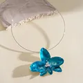 Close-up detail of a turquoise enamel flower collar necklace with rhinestone accents. - Choker (HN11956) / Light Blue