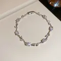 Detailed view of elegant silver vine bracelet with sparkling cubic zirconia stones - White Vine / Silver