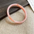 Elegante bracciale in calcedonio rosa con trama marmorizzata su sfondo rustico. - Arancione (Stile 17)