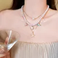 Multi-layer pearl necklace with starfish and mermaid tail charms for summer vacations - Three-Piece Set / Gold & White & Multicolor