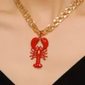 Detailed close-up of a vibrant red lobster pendant necklace on a gold metal chain for beach style - Red Lobster Pendant Cube Chain (3171) / Gold