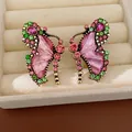 Detailed view of vintage butterfly earrings with pink resin and crystals. - Golden Butterfly Rhinestone Earrings / Silver Needle / Rose Red - Green