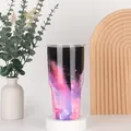 Detailed view of the 30oz nebula print stainless steel tumbler with a clear lid - 30oz