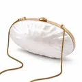 Detail of shell-shaped evening clutch with pearlescent finish and gold chain strap - Shell Color