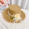 Women's summer straw sun hat featuring elegant white lace ribbon and floral accents - Khaki Flower Raw Edge Straw Hat (D-0027)