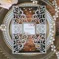 Silver glitter laser-cut wedding invitation sleeve with floral tag and white belly band - Glitter Silver