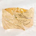 Detailed macro of gold-plated leaf hinge bracelet with polished leaf vein texture - Relief Foliage Style (11402)