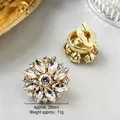 Detailed view of 28mm golden sunflower crystal brooch showing front and back texture - 28mm