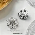Detailed view of flower-shaped pearl and rhinestone brooch with 24mm size measurements - 24mm / Silver Pearl Rhinestone Flower (E1621-13)