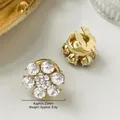 Gemelli a fiore dorati da 23mm con cristalli bianchi e struttura in metallo - 23mm