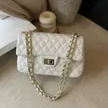 White quilted faux leather shoulder bag with gold chain strap and turn-lock closure - White