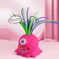 Jouet anti-stress monstre rose avec cheveux colorés qui crient quand on les tire - Rose