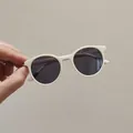 Kids round retro sunglasses with creamy white frame and dark UV protective lenses - Beige/Black Lens
