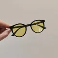 Classic kids round frame sunglasses featuring black trim and yellow transparent lenses - Black Frame Yellow Lens