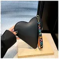 Fashionable black heart-shaped handbag with pebbled leather and colorful LOVE strap - Black