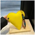 Fashionable heart-shaped yellow handbag with lychee texture and LOVE letter strap - Yellow