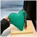 Green heart-shaped handbag in lychee leather with a wide colorful LOVE embroidered strap - Green