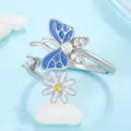 Silver open ring with blue butterfly and white daisy detail on a blue surface - Blue Butterfly Daisy Silver Open Ring (4327)