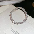 Bracelet élastique élégant avec perles rose tendre et sphères de cristal zircon brillantes. - Perles Artificielles Roses Enfilées (36#) / Perles 8mm / Rose-8mm (36#)