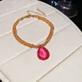 Light luxury French style orange beaded bracelet featuring a pink teardrop crystal pendant - Bracelet (HN11875) / Brown and Pink