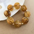 Pulsera bohemia de acrílico jaspeado ámbar con detalles dorados para estilo de playa - Pulsera / Café
