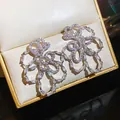 Elegante zilveren vlinder oorbellen met zirkonia in een luxe geschenkverpakking - Stijl 63 (HE32568)