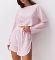 Pink two-piece set featuring long sleeve eyelet crop top and matching shorts with side slits - S / Pink