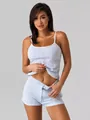 Close-up of light blue ribbed knit camisole and shorts set with hollow dot pattern details - S / Light Blue